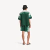 Calções masculinos de corte descontraído com estampado tie-dye extremo em verde/branco