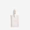Etiqueta de bagagem com perfumes em branco marfim dix