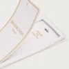 Etiqueta de bagagem com perfumes em branco marfim dix