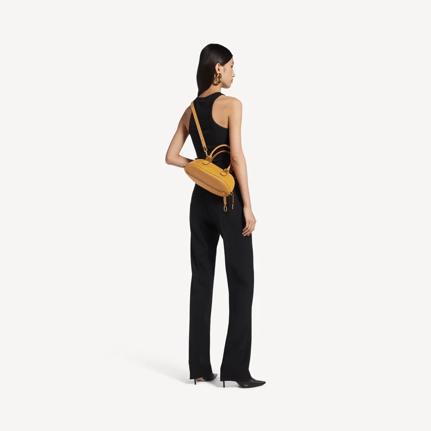 Mala de bowling feminina «Bolero» mini em cor de caril Mala de bowling feminina «Bolero» mini em cor de caril
