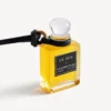 Pingente em forma de frasco de perfume em miniatura, na cor preta