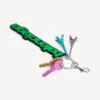 Porta-chaves/charm Balenciaga estilo motoqueiro para mulher em verde/preto