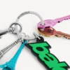 Porta-chaves/charm Balenciaga estilo motoqueiro para mulher em verde/preto