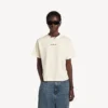 T-shirt feminina Balenciaga com design nas costas e corte médio, na cor creme